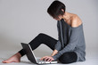 Young woman on floor with notebook