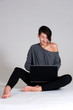 Young woman on floor with notebook