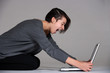 Young woman on floor with notebook