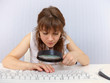 Woman with poor eyesight to work with keyboard Woman with poor eyesight to work with keyboard