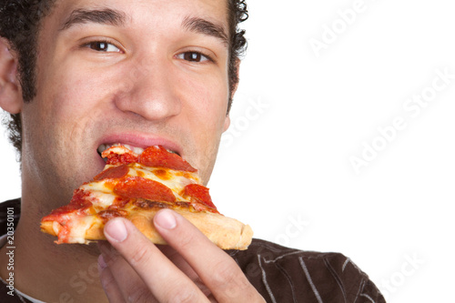 Photo: Young Man Eating Pizza Young Man Eating Pizza