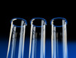 Illustration: Three empty test tubes. View from below. Three empty test tubes. View from below.