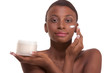 Topless ethnic Black woman moisturizing face