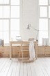 Desk in window area of loft apartment