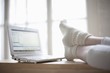 Feet up in loft apartment with laptop