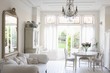 Daybed with cushions and glass chandelier in white home interior