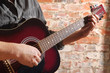 Playing on acoustic guitar