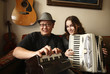 Couple playing organ and accordion