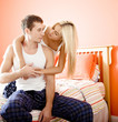 Woman and Man Hugging in Bedroom