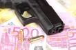 Gun and money with cartridges