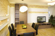 Interior details of dining table and chairs in stylish home.