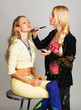 Professional beautician applying makeup Professional beautician applying makeup