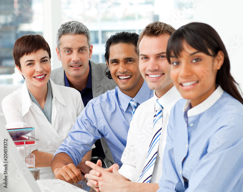 Photo: Portrait of multi-ethnic business team at work Portrait of multi-ethnic business team at work