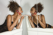 Photo: Attractive Young Woman Holding Cell Phone and Laughing Attractive Young Woman Holding Cell Phone and Laughing