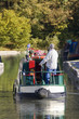 Man steering narrow boat in canal