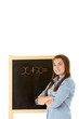 Female Student Standing Next To Blackboard Female Student Standing Next To Blackboard
