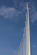 Stadium light pole, blue sky a few clouds
