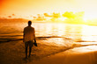 young man and sunset on Caribbean sea young man and sunset on Caribbean sea