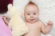 Happy baby with a teddy bear