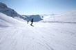 alpine skiing: going down a blue slope in French Alps alpine skiing: going down a blue slope in French Alps