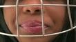 Black woman with a cricket helmet and ball Black woman with a cricket helmet and ball