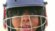 Black woman with a cricket helmet Black woman with a cricket helmet