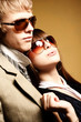 Fashionable young couple wearing sunglasses Fashionable young couple wearing sunglasses