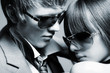 Fashionable young couple wearing sunglasses Fashionable young couple wearing sunglasses