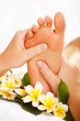 Foto: Exotic foot massage and spa foot treatment. Exotic foot massage and spa foot treatment.
