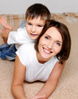 Beautiful young mother with the lovely smiling son