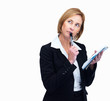 Thoughtful female writer daydreaming while writing