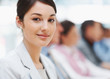Closeup of a cute young businesswoman at a conference