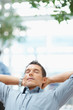 Relaxed successful business man with lots of copyspace