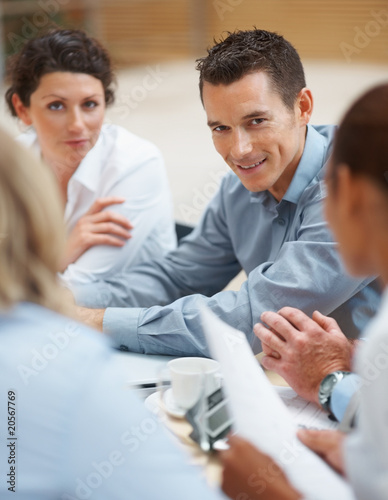 Photo: Happy business man at a board room meeting Happy business man at a board room meeting