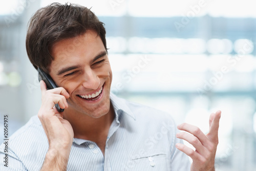 Young handsome guy enjoying a telephonic conversation Young handsome guy enjoying a telephonic conversation