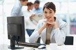 Photo: Pretty Caucasian business woman at office desk Pretty Caucasian business woman at office desk