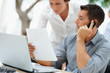 Busy businessman working with colleague at office