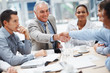 Senior business man congratulating a colleague