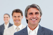 Self-assured businessman and his team