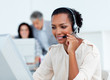 Confident businesswoman talking on headset