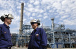 oil workers and refinery plant