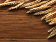 Wheat spikes on wooden board