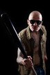 Man with bat and tattoos Man with bat and tattoos