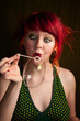 Punky Girl with Red Hair Trying to Blow a Bubble Punky Girl with Red Hair Trying to Blow a Bubble