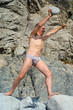 Man pushes stone ball 4 Man pushes stone ball 4