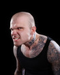 Tattooed Angry man with evil eyes Tattooed Angry man with evil eyes