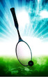 A tennis racket and ball placed in a floor