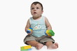 Baby boy playing with building blocks
