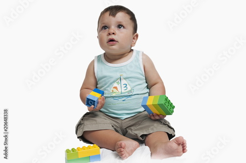 Photo: Baby boy playing with building blocks Baby boy playing with building blocks