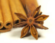 Star anis with cinnamon barks on white background